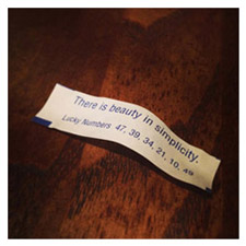 Fortune cookie message that reads: There is beauty in simplicity.